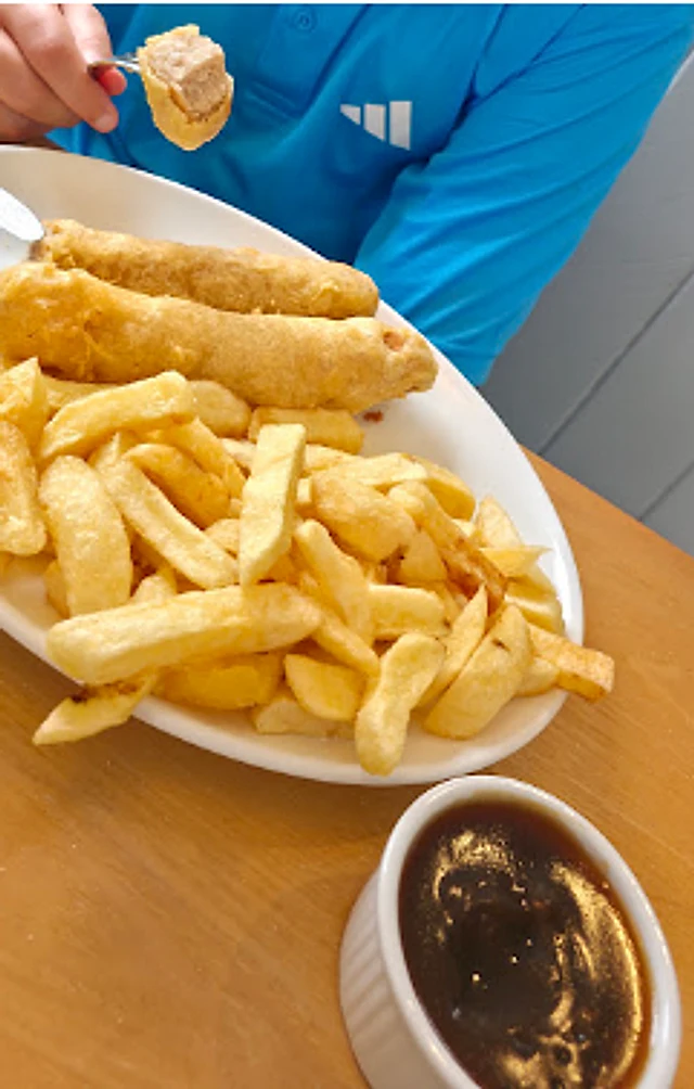 Fish and chips served with sauce