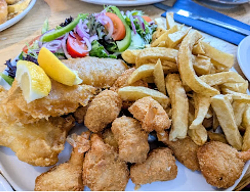 Mixed seafood platter with chips and salad