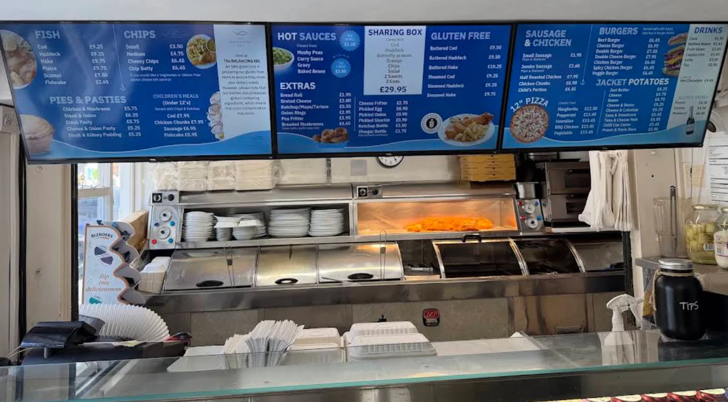 The takeaway counter and menu boards at The Balancing Eel